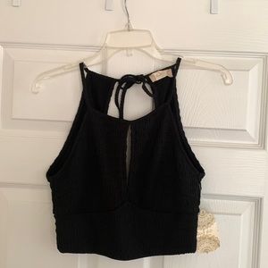 Black textured crop top with cut outs